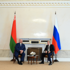 Source: Russian President Vladimir Putin and Belarusian President Alexander Lukashenko talk during a meeting in Saint Petersburg, Russia July 13, 2021. © Reuters