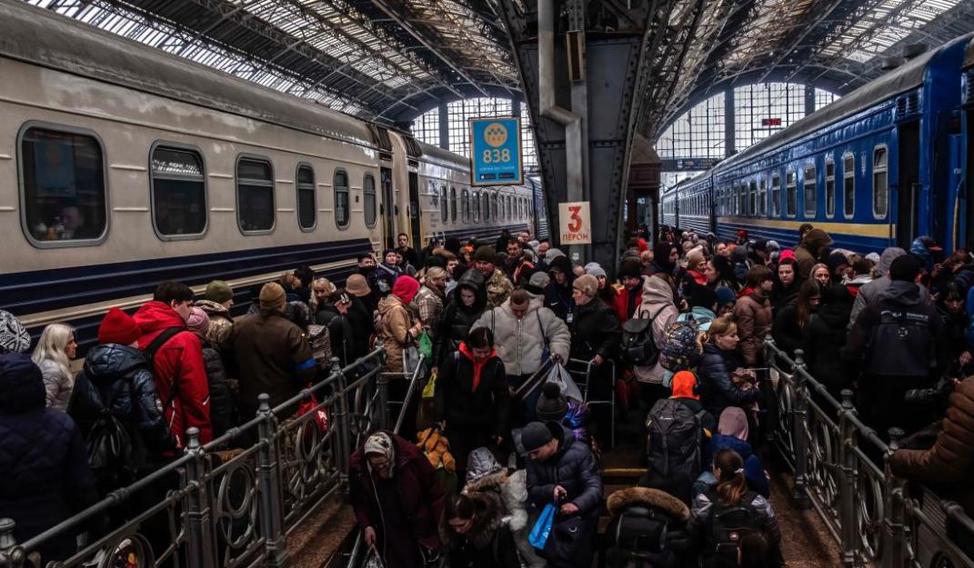 Source: Refugees from Maiurpol arriving at the train station of Lviv meet with others going to take a train for Poland, 5 April 2022 ©Reuters