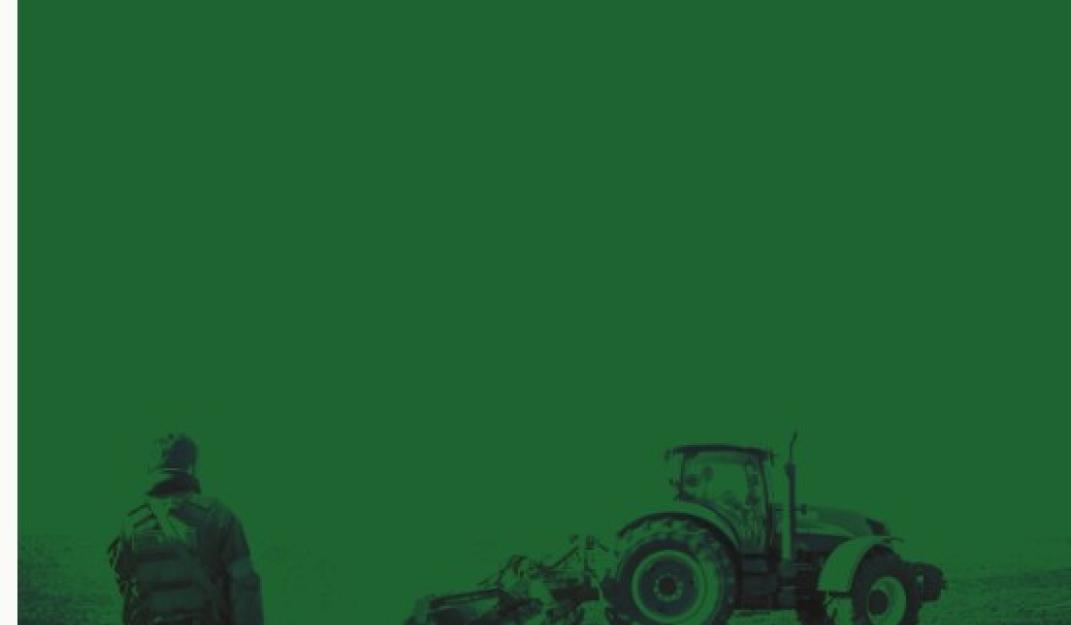 Man standing with tractor