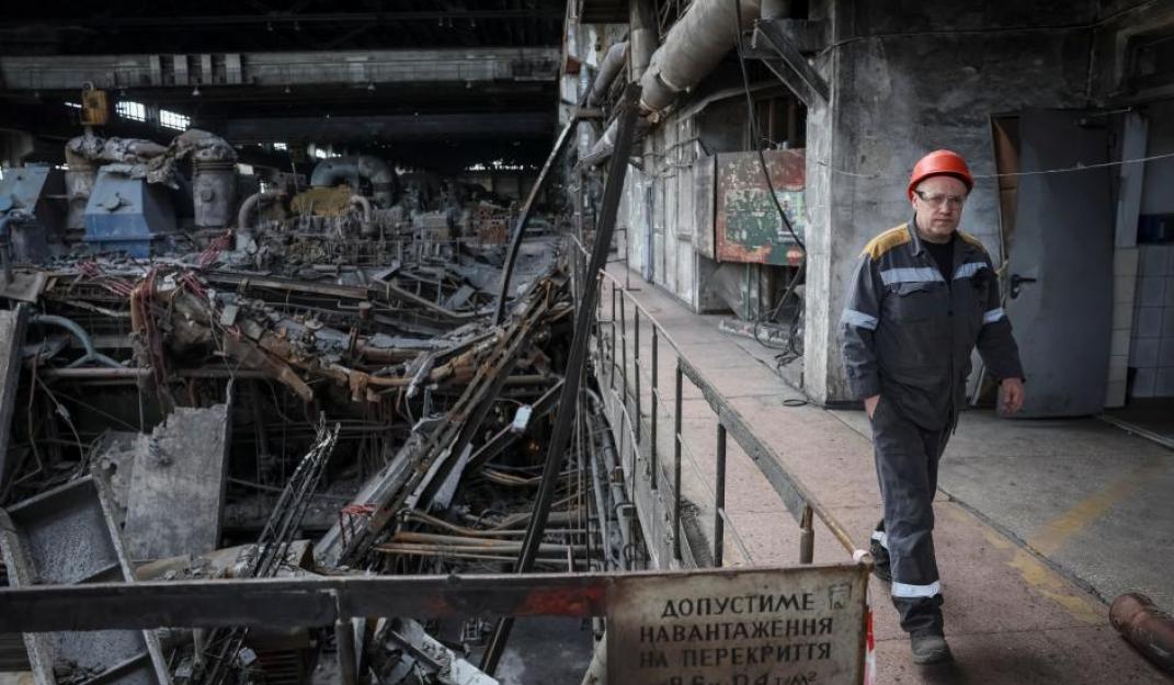 A worker walks at a thermal power plant damaged by recent Russian missile strike, amid Russia's attack on Ukraine, in an undisclosed location of Ukraine April 8, 2024. ©Reuters