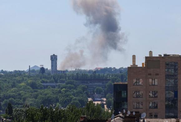 Source: Smoke rises over the city following recent shelling in the course of Ukraine-Russia conflict in Donetsk, Ukraine June 20, 2022. REUTERS