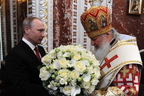 Vladimir Putin and Patriarch Kirill at the Easter service in the Cathedral of Christ the Saviour, Moscow, 1 May 2016. Photo: kremlin.ru via Wikimedia Commons, CC BY 4.0